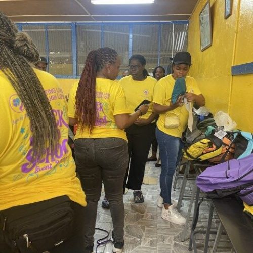 Organizing backpacks and packages at the Back-to-School Drive
