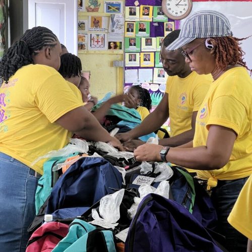 Love of Hearts Foundation members organizing back to school packages.