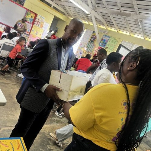 Handing over Package at the Love of Hearts Foundation back-to-school Drive