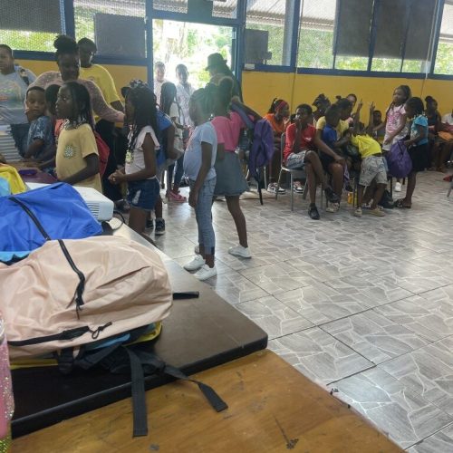 Student lining up to collect their packages from the Love Of Hearts Foundation back to school drive